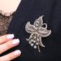 Broche or gris diamant(s) t. ancienne 