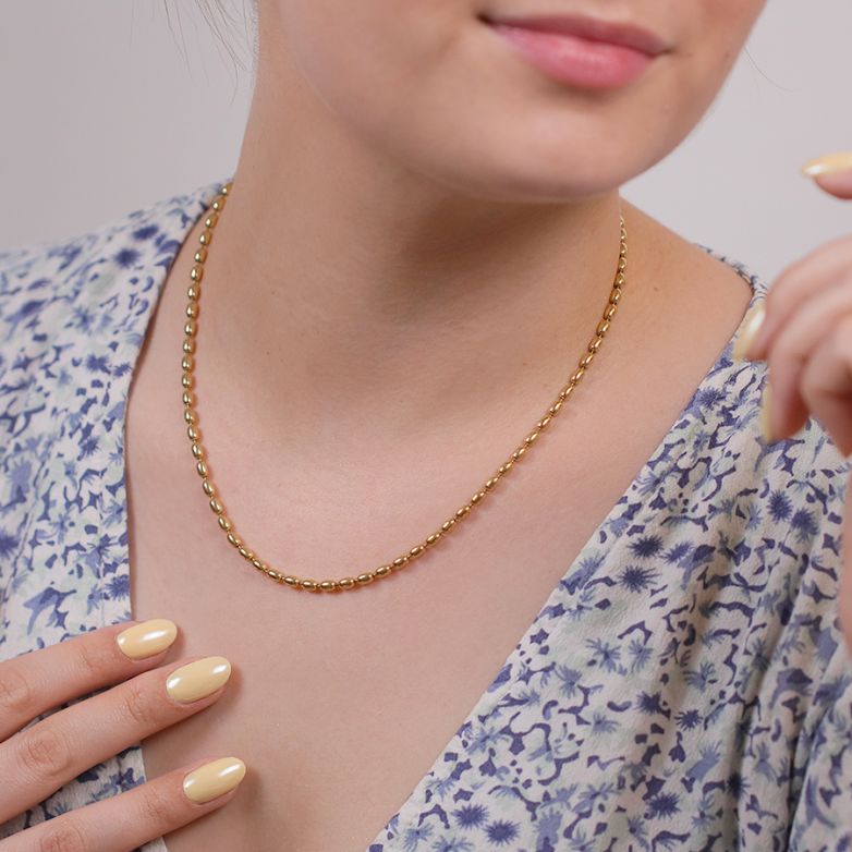 collier or jaune 
