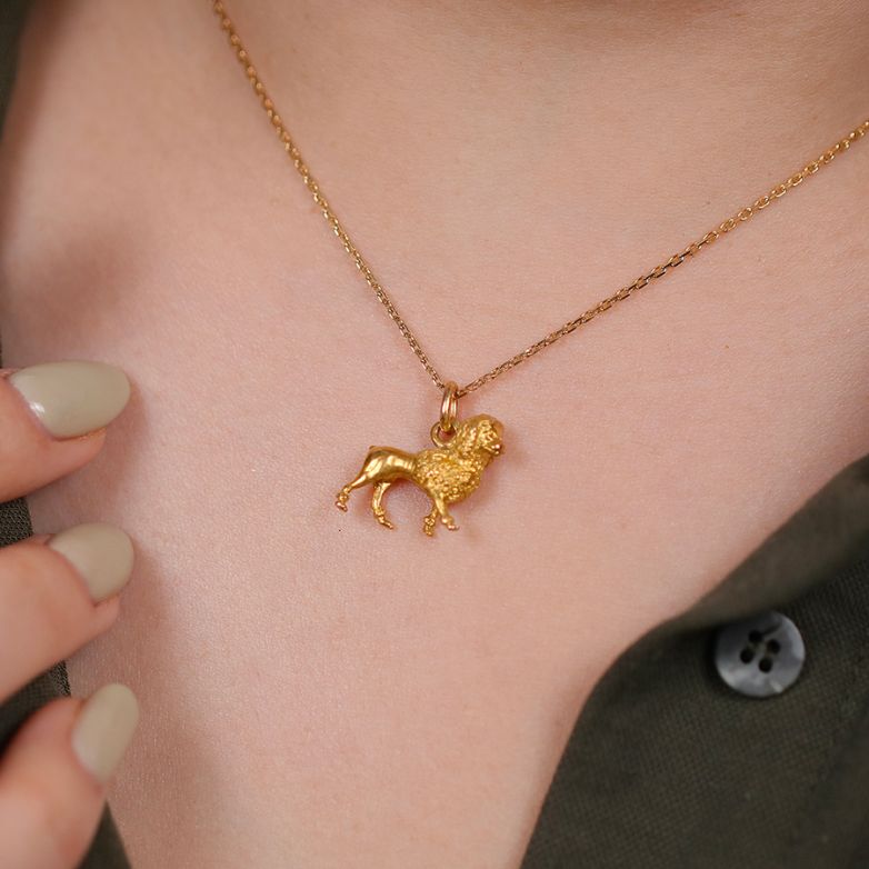 Yellow gold poodle pendant...