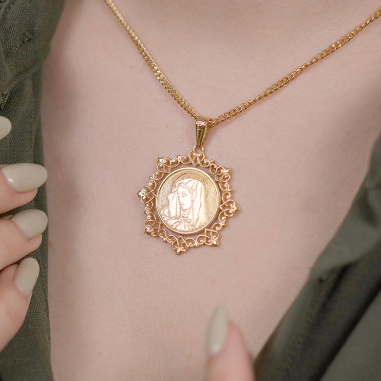 Virgin Mary medal in yellow...