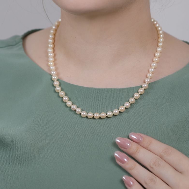 Yellow gold choker pearl...
