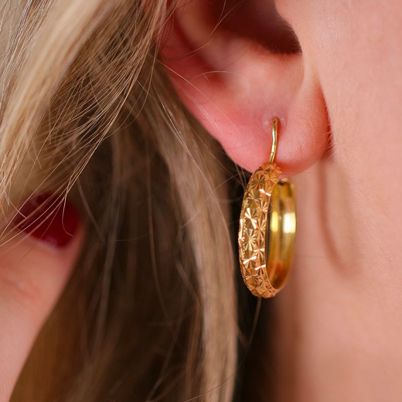 Yellow gold hoop earrings...