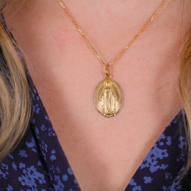 Virgin Mary medal in yellow...