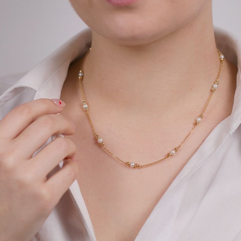 Yellow gold cultured pearl...