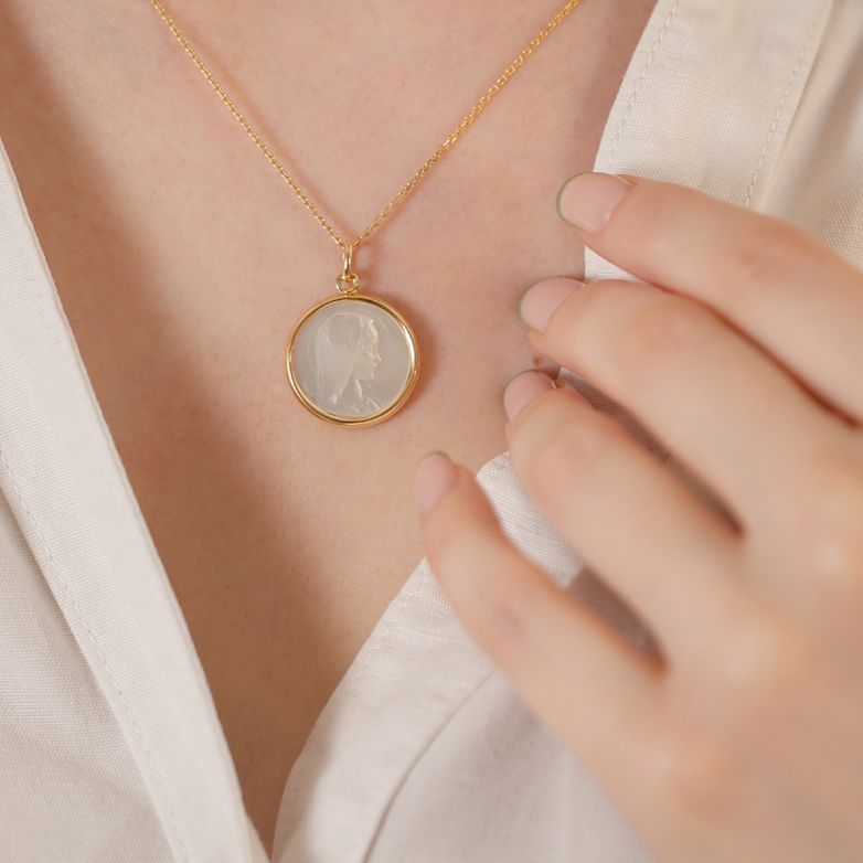 Virgin Mary medal in yellow...