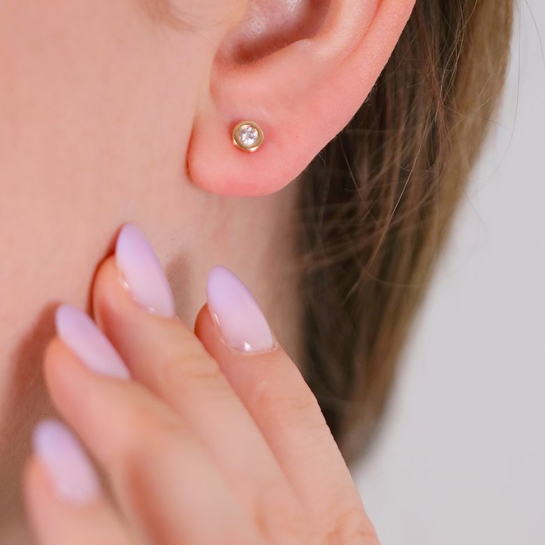 0.20-carat diamond earrings...