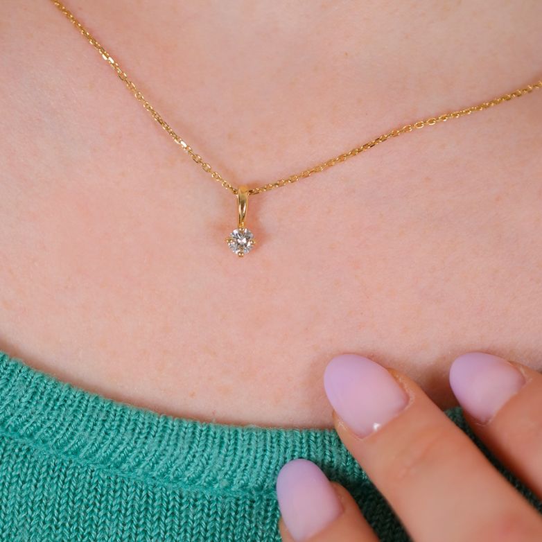 0.24-carat diamond pendant...
