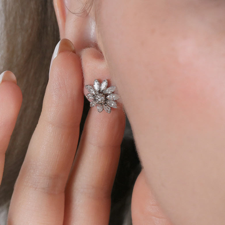 1.44-carat diamond earrings...