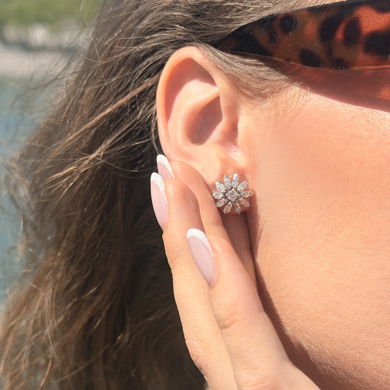 1.44-carat diamond earrings...