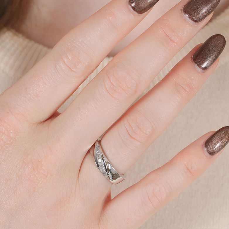 0.13-carat diamond ring,...