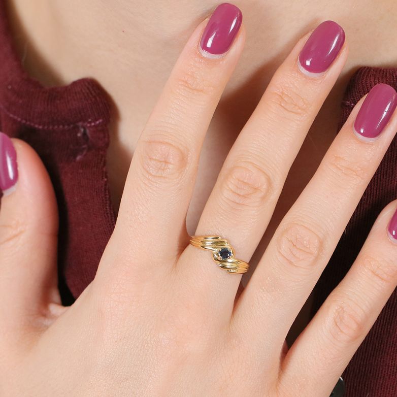 0.13-carat sapphire ring in...
